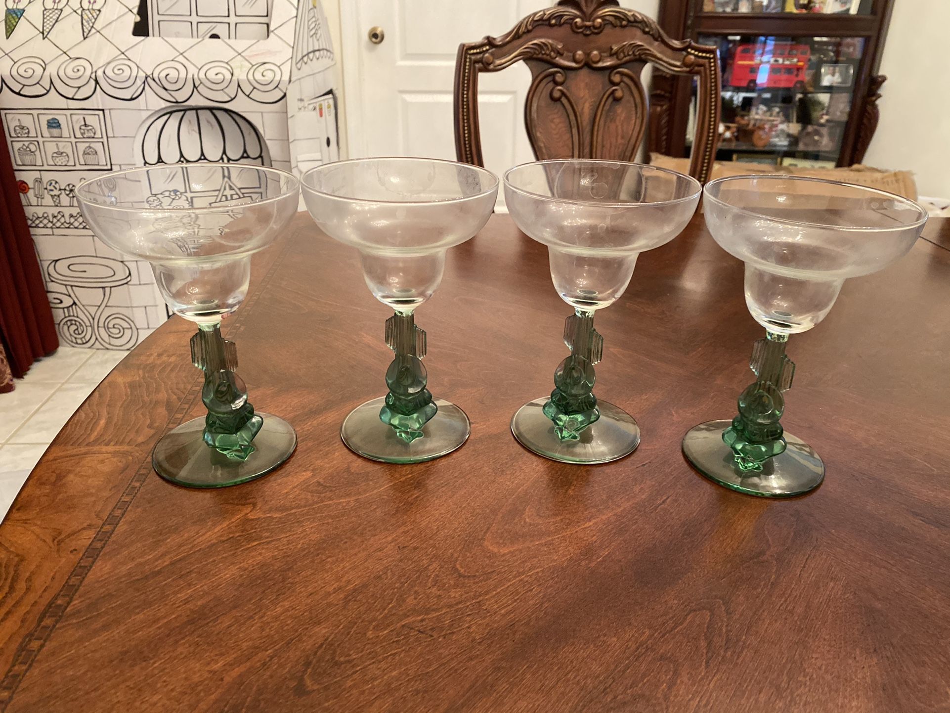 Four Margarita Glasses With Sleeping Man