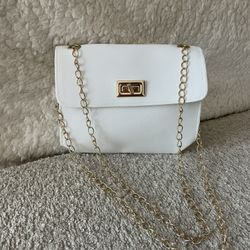 White purse with gold hardware