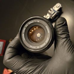 Canon AE1/AT Bodies And FD Lens