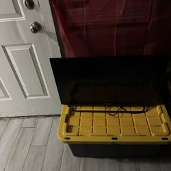 Tv And Yellow And Black Storage Box