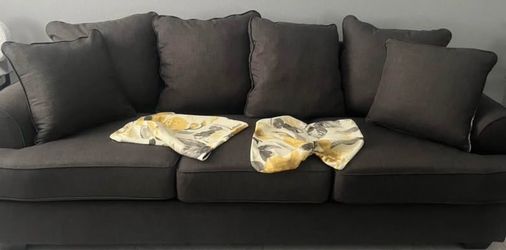 Grey sofa (is not a sofa bed) excellent condition. Extra pillow cushions included.