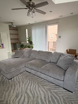 Light grey couch with storage