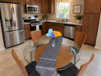 Modern glass top dining table and chairs