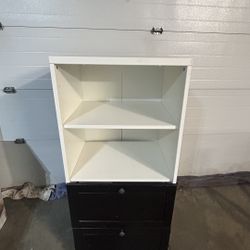 Two tone storage dresser unit 51”T 23.5”L 19.25”D white open 2 shelf top on black 2 drawer cabinet base