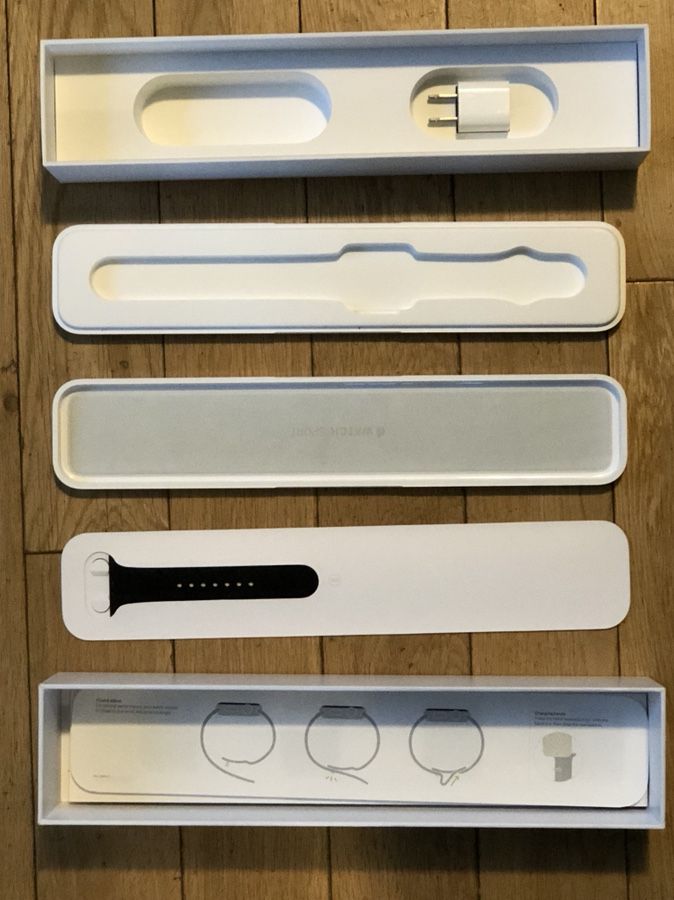 Apple Watch box with watch band and adapter
