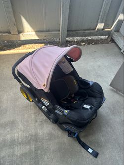 Pink doona stroller