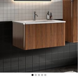 Beautiful Brand New 30” Wall Mount Vanity With Sink. Excellent condition.