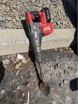 Milwaukee Roto hammer with shovel attachment and big battery