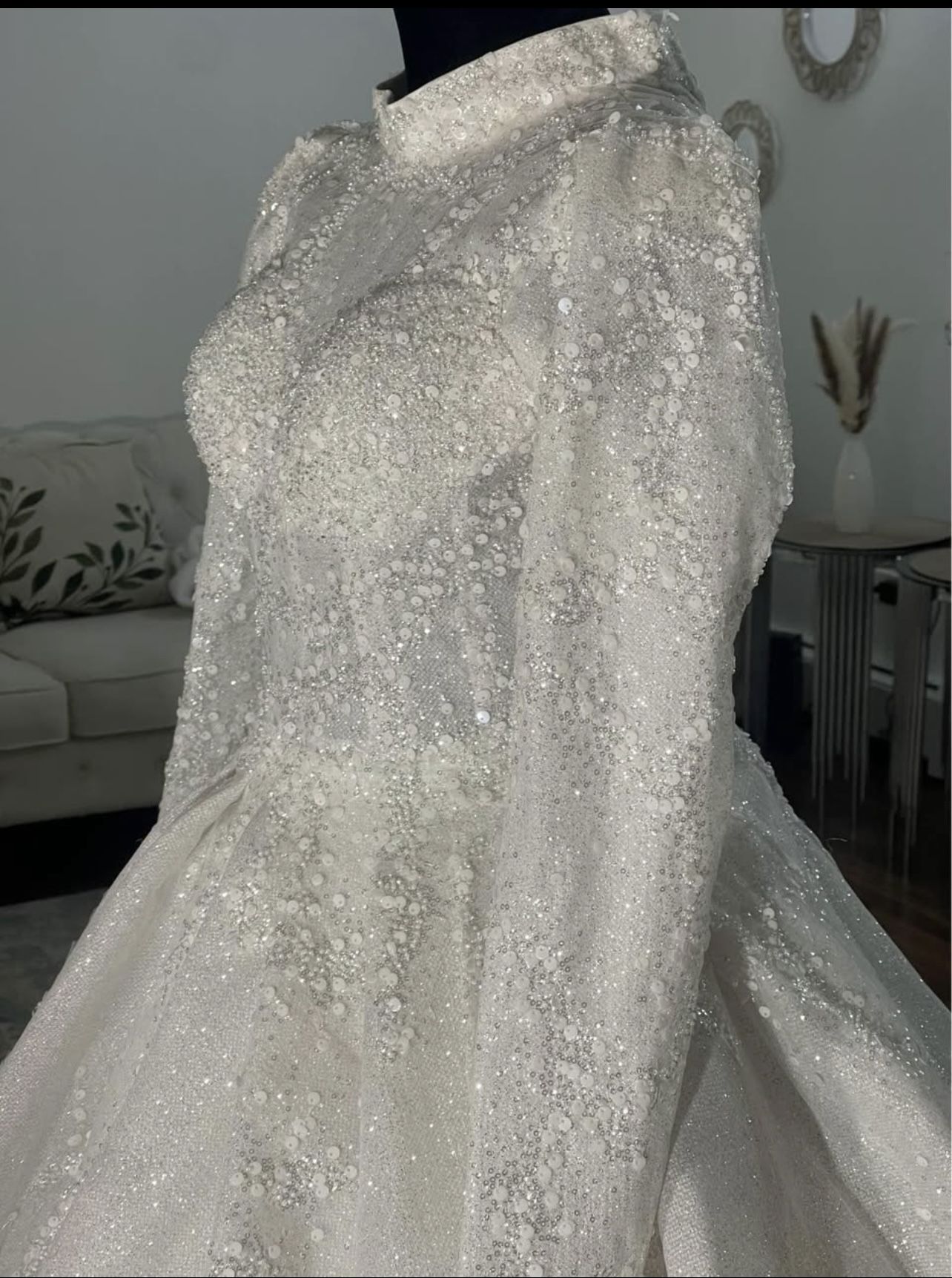 Luxurious wedding dress with bouquet of roses and crown