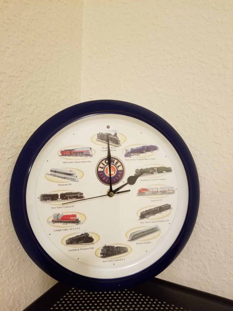 Clock with train pictures and sound. Has an Alarm system as well.