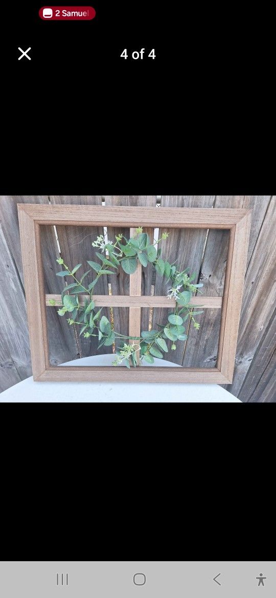 19 1/4in x 23 1/2in Farmhouse Wall decor art framed with small whited flowers surrounding a beautiful leafy vine. Can be hung with wise or lengthwis