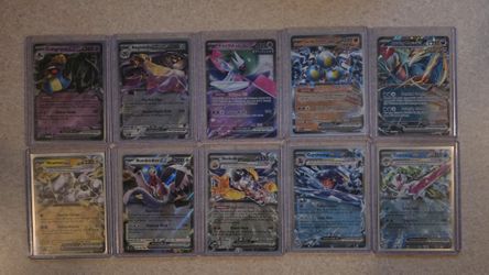 Almost completed base set Pokémon Paradox Rift. 206 cards plus 10 EX cards. 216 cards total.