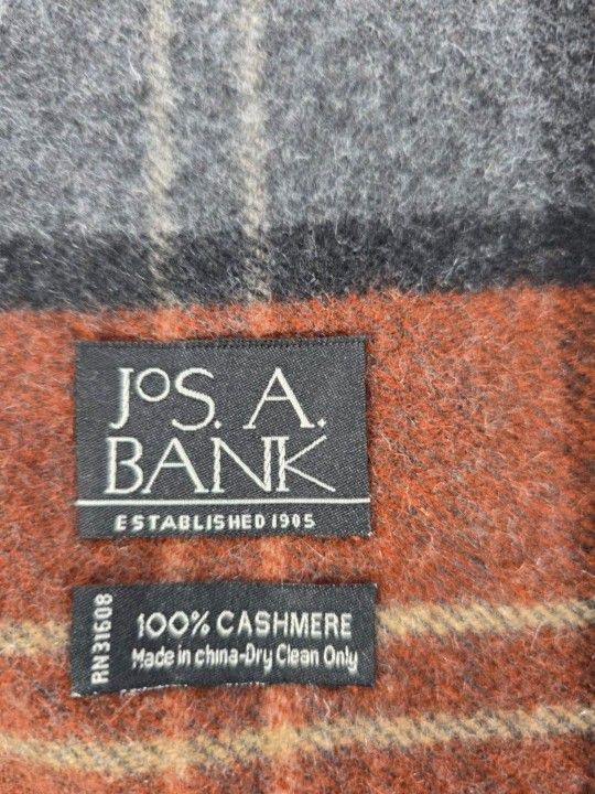 JoS A Bank 100% Cashmere Men's Scarf. The scarf has fall/ winter colors.