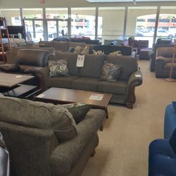 Brown Sofa And Loveseat With Wooden Base