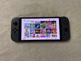 Nintendo Switch OLED with 100 SWITCH GAMES + 7500 Classic Games