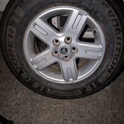 One mercury Mariner Rim And Tire