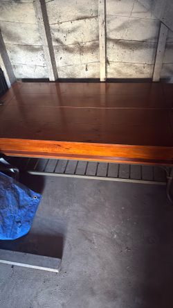 Wood coffee table with a storage compartment inside for magazines or blanket .