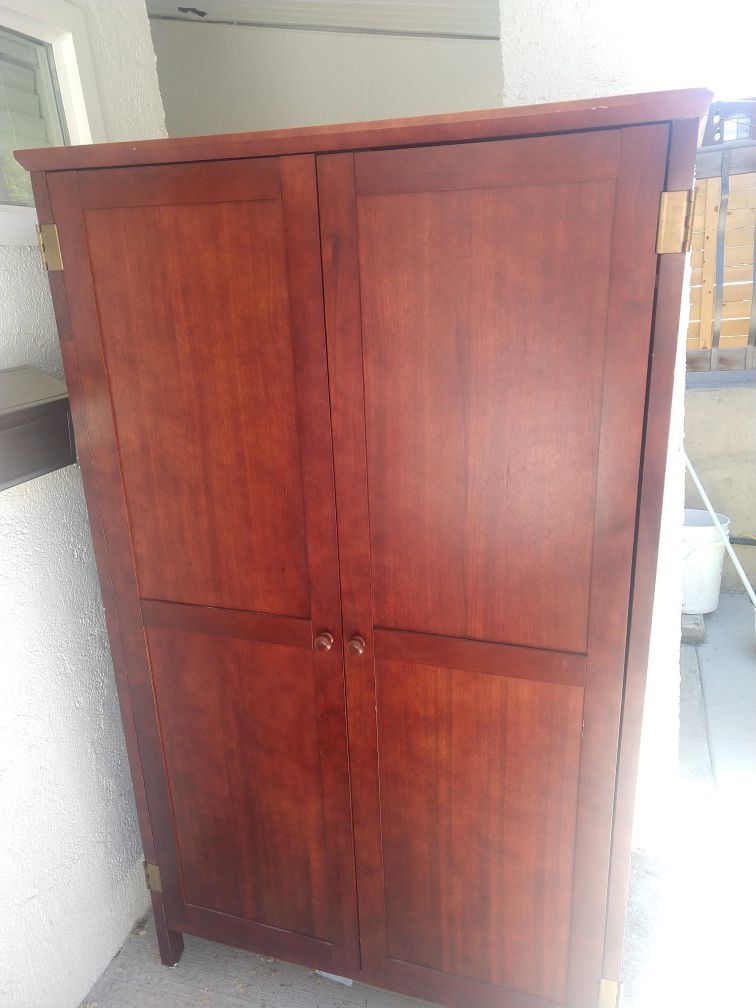 Large cabinet with pull out desk
