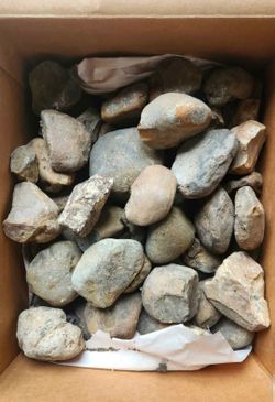 Round large pebble beach rock brown beigh landscaping