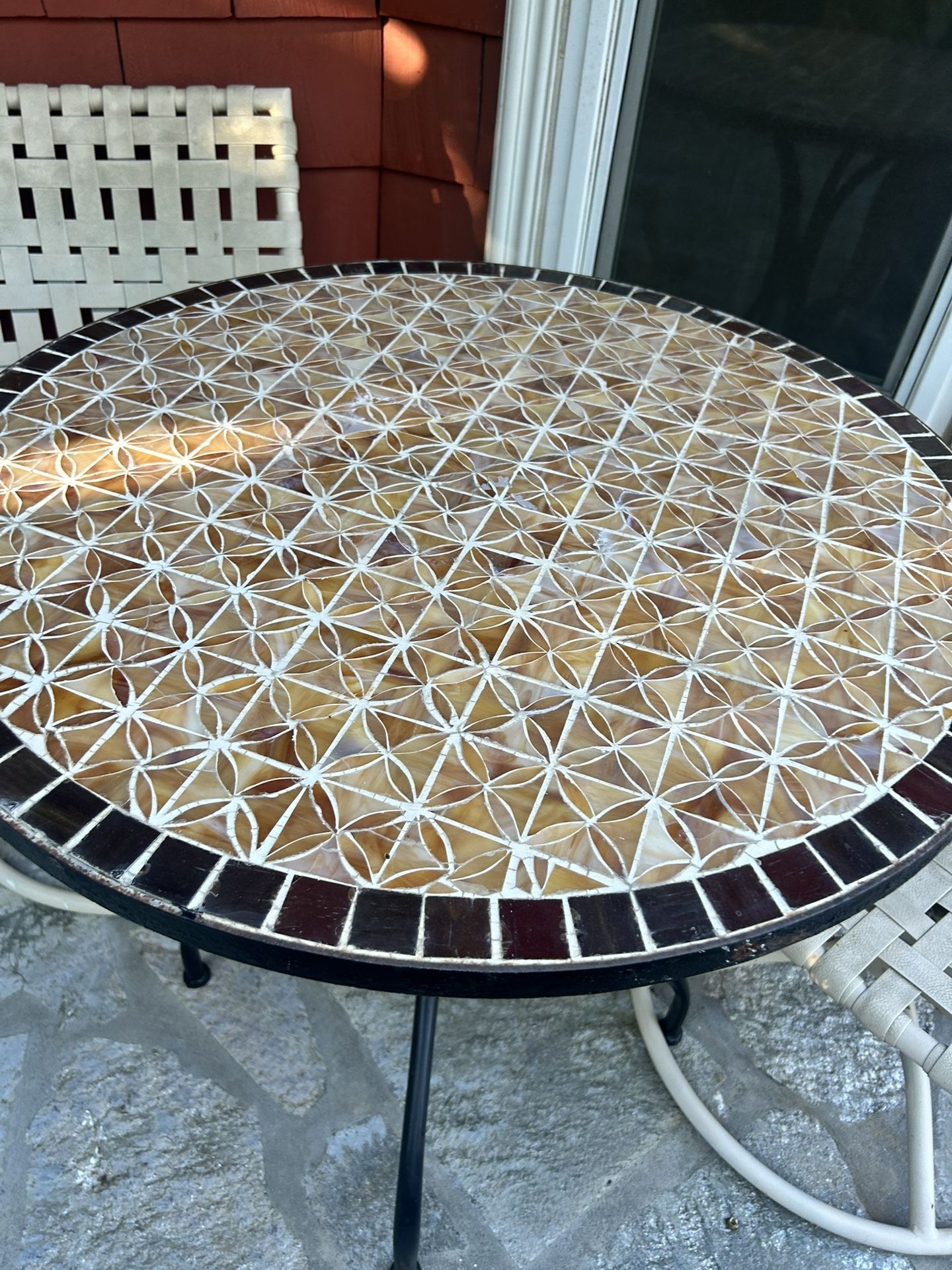 3 Piece Outdoor Bistro Set with Tiled Table Table is hand made tile and heavy. Chairs are swiveling