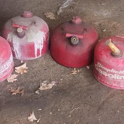 4 old steel gas cans