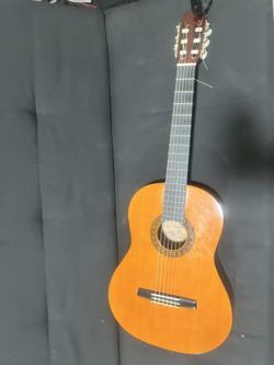used guitar tuned brand new strings tuner included