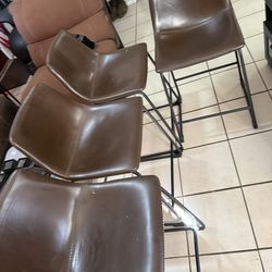 4 brown high chairs