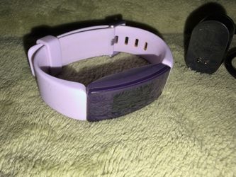Purple Fit Bit watch with adjustable band
