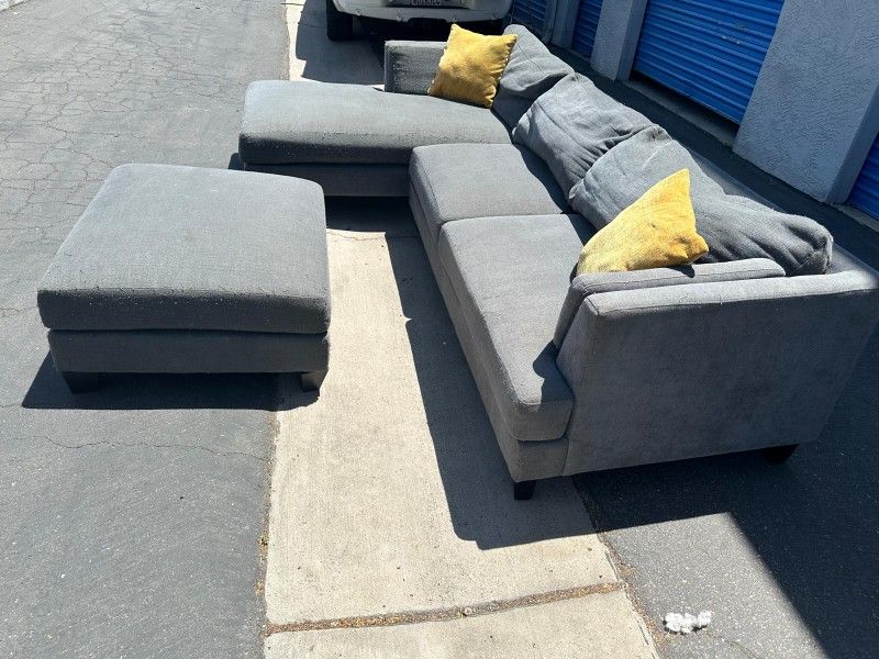 Gray Sectional Couch And Ottoman Seat,