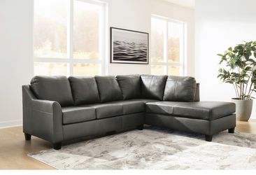 Genuine leather sectional by Ashley
