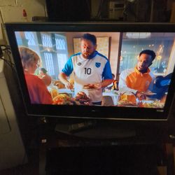 42  Inch Older Model Sony TV  That Swivel Come With TV Stand And Remote Control It's All Good.
