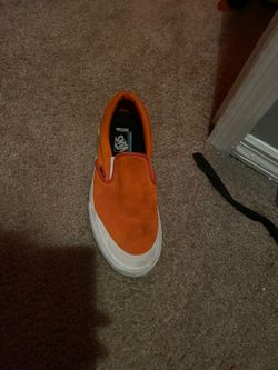 Orange vans slip ons