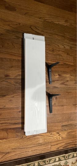 IKEA white shelves and black brackets