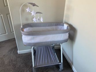Baby Bassinet with Mobile and Storage Shelf
