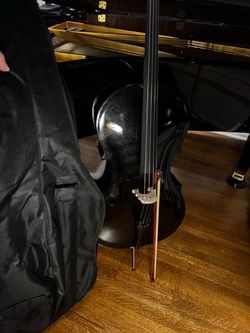Polished glossy black wooden cello full size