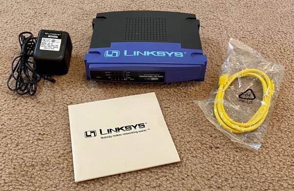 Working Linksys Etherfast Router With 4 Port And AC Adapter Cable BEFSR41 v.2 With CD Included