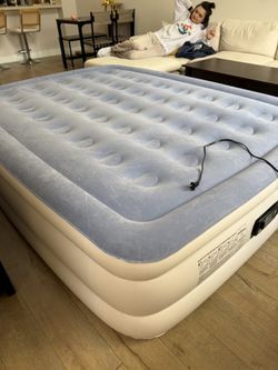 Queen Size  Air Mattress (inflates and deflates from a power outlet)