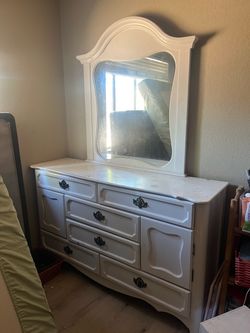 white wooden dresser with mirror