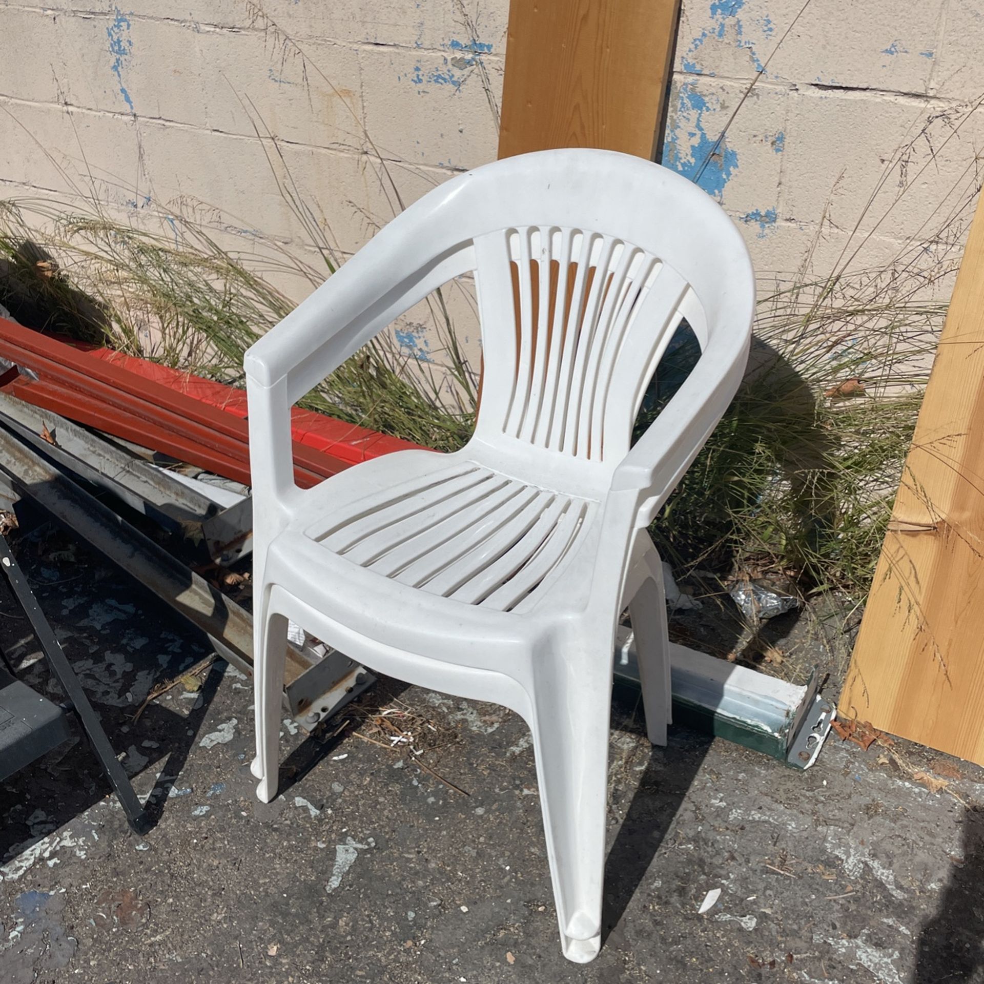 Two White Plastic Chairs