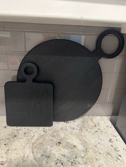 2 black cutting boards