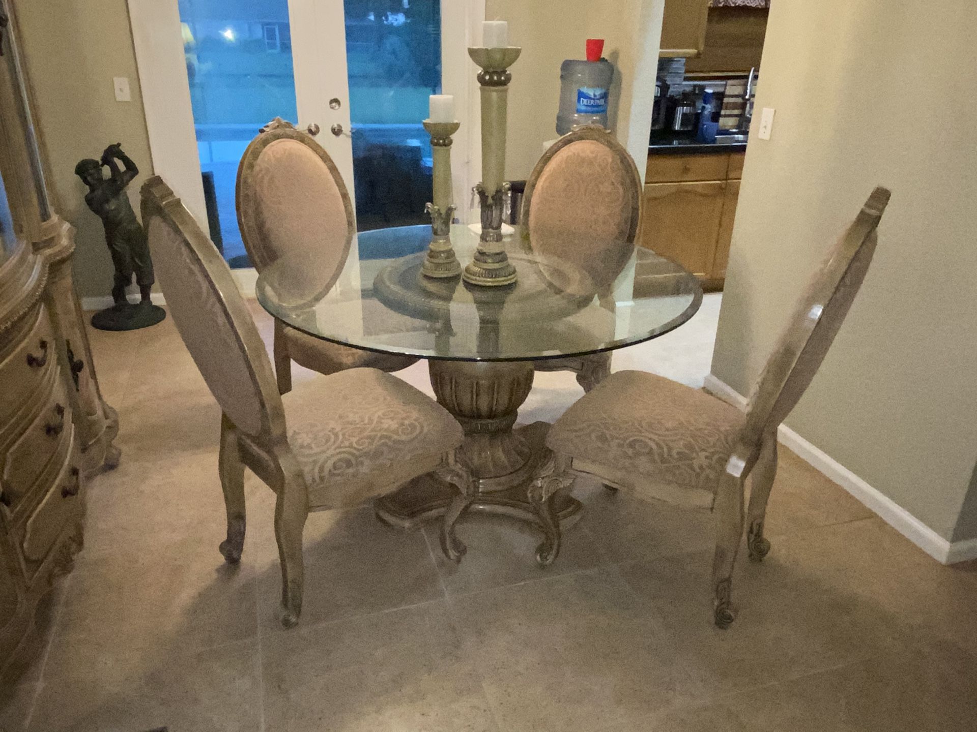 Formal glass top dinning room table and chairs