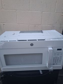 GE MICROWAVE. NEW TESTED AND OPERATIONAL.