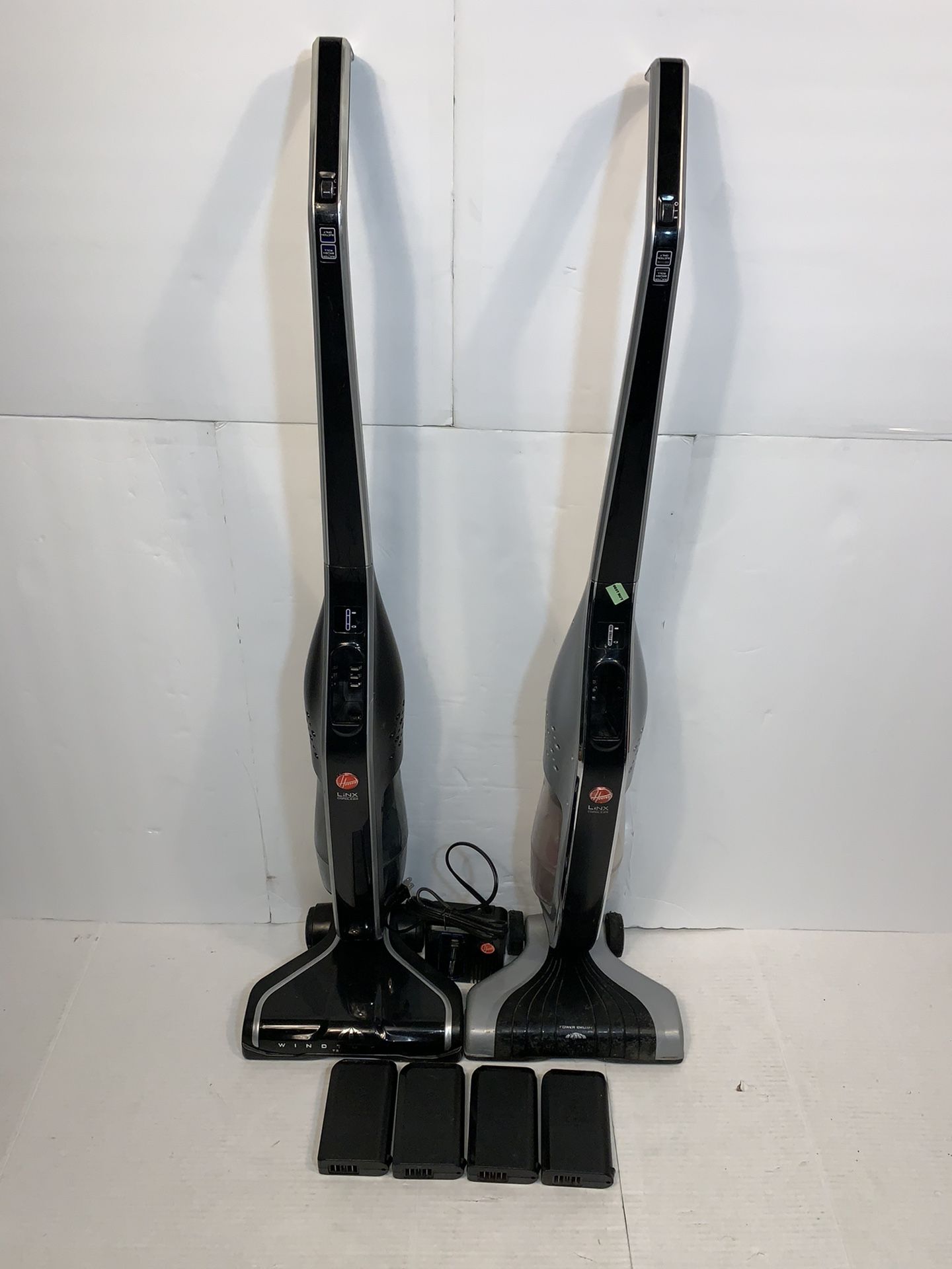 Two Hoover LINX Cordless Stick Vacuum Cleaners With 4 Batteries & Charger