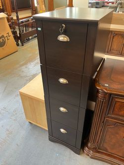 Dark brown or black filing cabinet (in store)