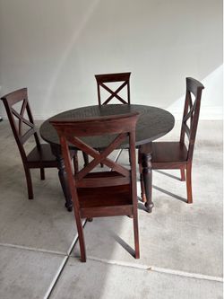 Dark wood round dining table with 4X back chairs