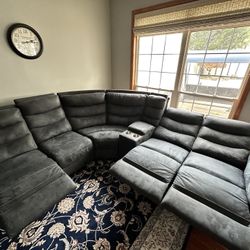 Gray 6 Piece Power Reclining Sectional with stainless steel cup holders and hidden storage 1350USD
