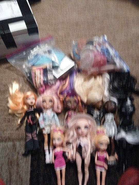 Rainbow And Monster High Dolls