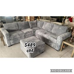 Dark gray corduroy sectional sofa with ottoman