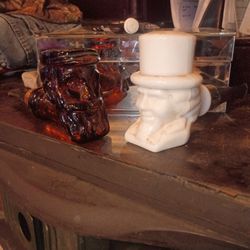 This vintage ceramic item is an Uncle Sam figural head vase or planter. 