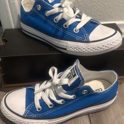 Little kid bright blue converse shoes